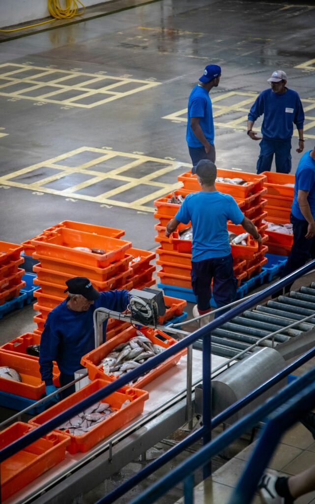 Warehouse workers managing stock in a just-in-time inventory system