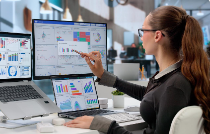 Data analyst reviewing business intelligence charts and dashboard metrics