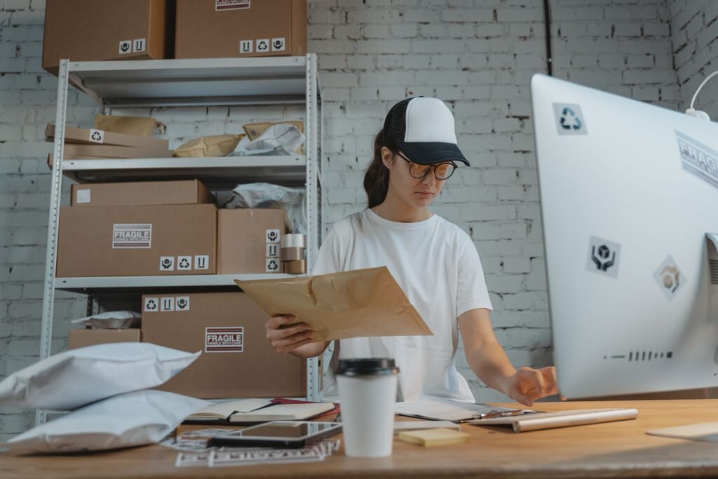 Logistics professional managing shipments on a computer