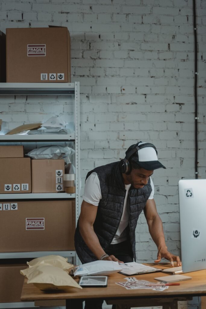 Warehouse employee using a WMS for inventory management